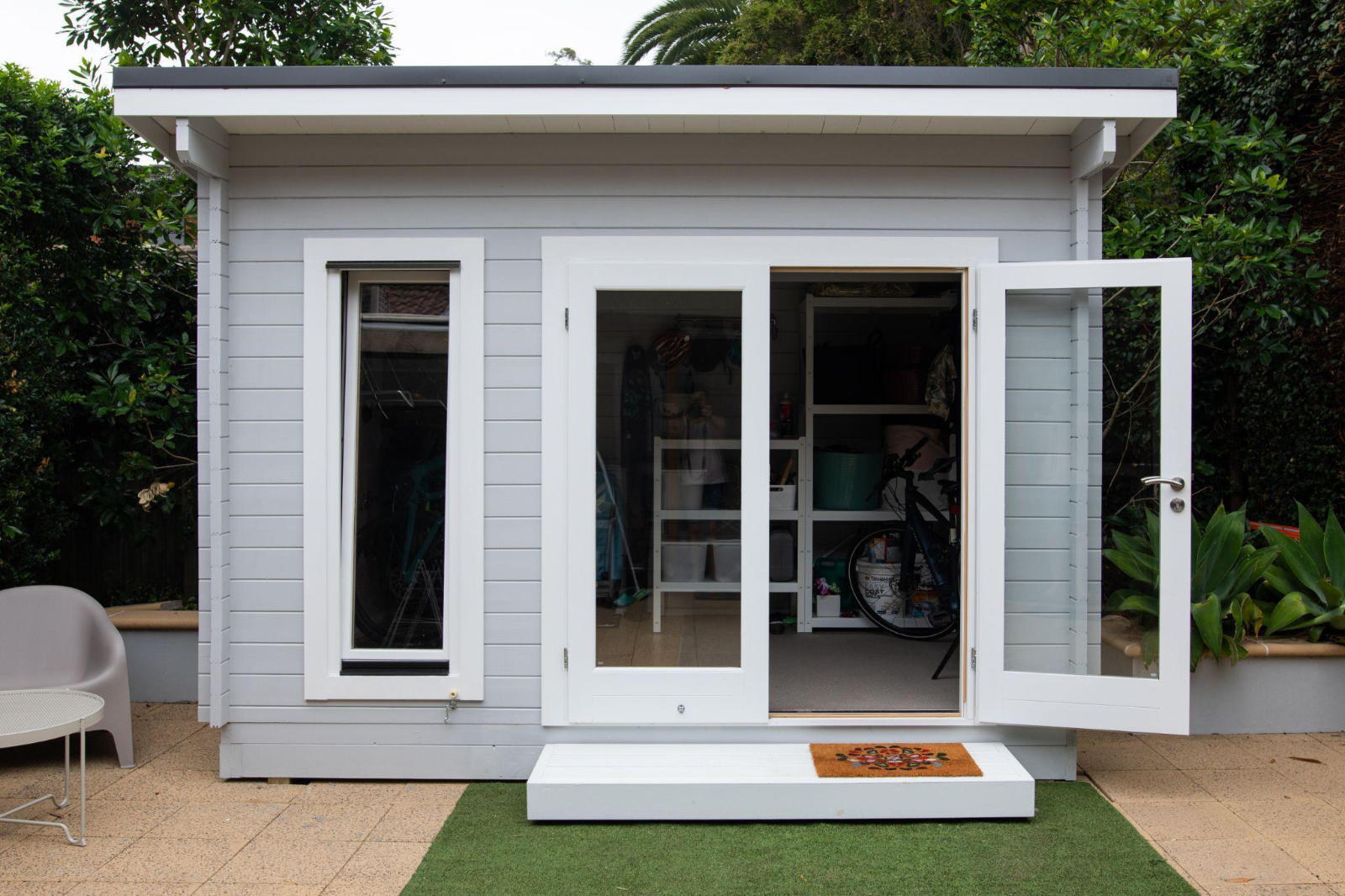 Modern backyard office shed with full power and glass doors.